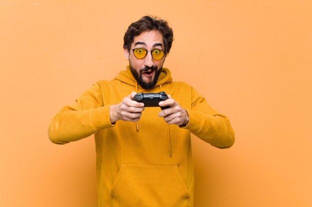 Young man holding a game console