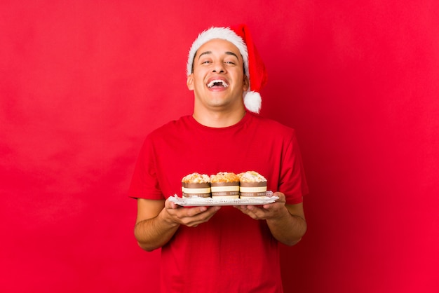 Young man holding a gift on christmas day