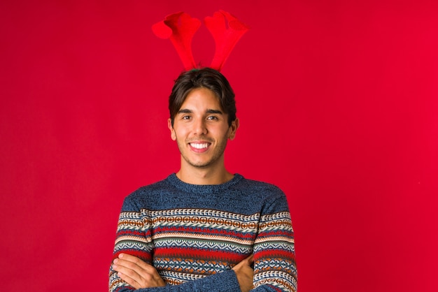 Young man holding a gift on christmas day