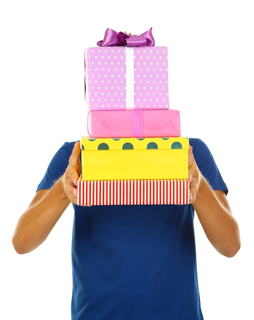 Young man holding gifts, isolated on white