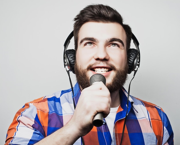 Young man holding a microphone