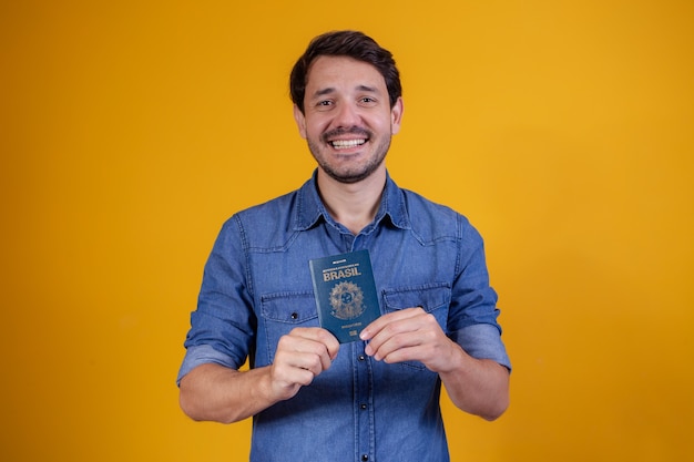 Young man holding a passport