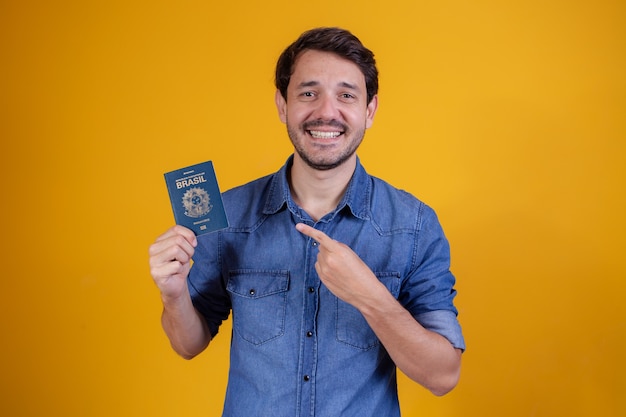 Young man holding a passport