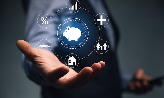 Young man holding phone with piggy bank icon