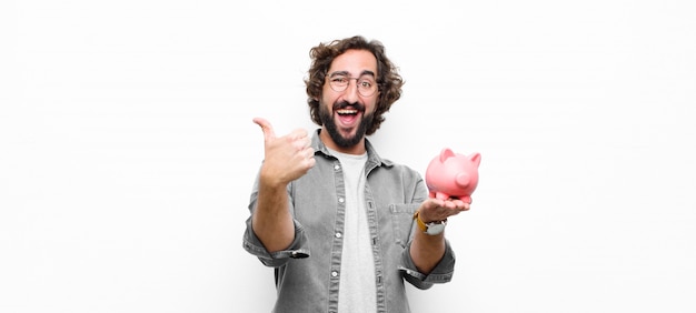 Young man holding a piggy bank