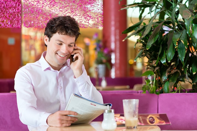 Young man in ice cream parlor