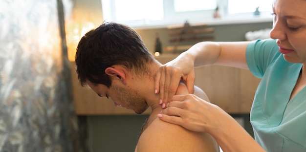 Young man is having massage on spa treatment