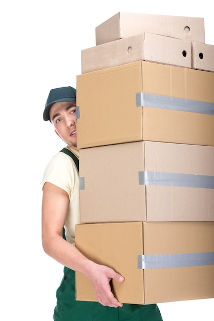 Young man is holding cardboard boxes