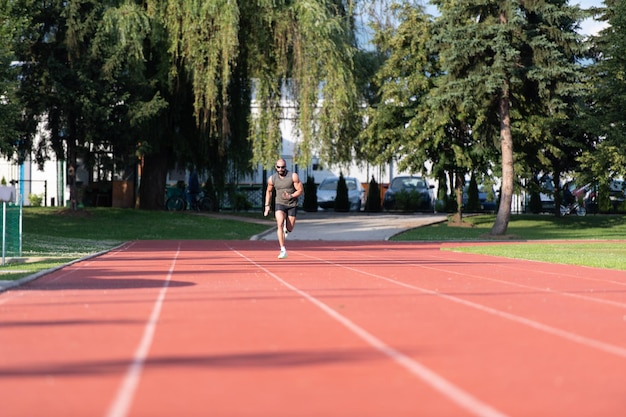 Young Man Is Jogging on Sunny Day