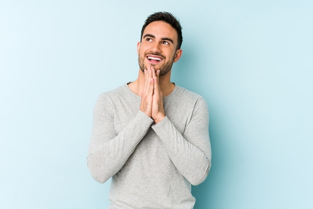 Young man isolated on blue