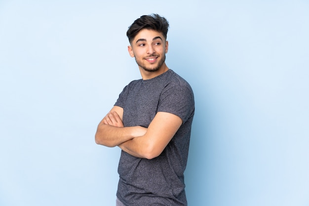 Young man isolated on blue