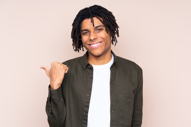 Young man over isolated wall