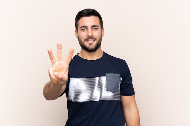 Young man over isolated wall