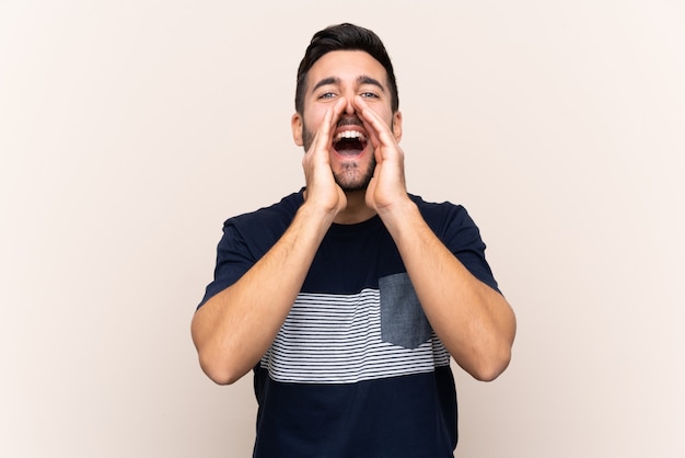 Young man over isolated wall