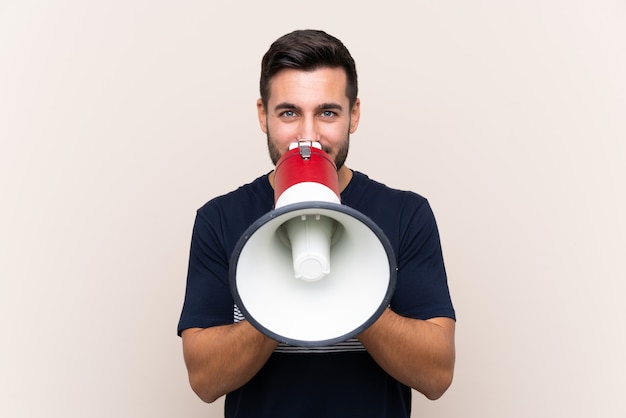 Young man over isolated wall