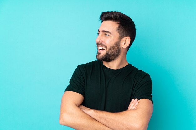 Young man over isolated wall