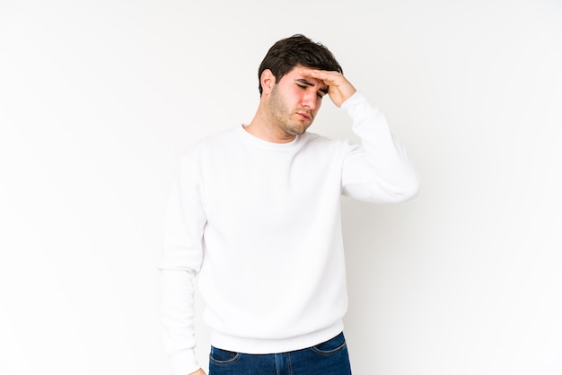 Young man isolated on white background touching temples and having headache.