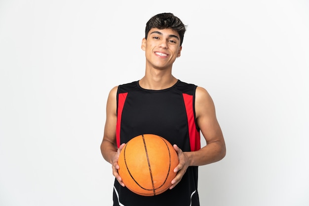 Young man on isolated white playing basketball