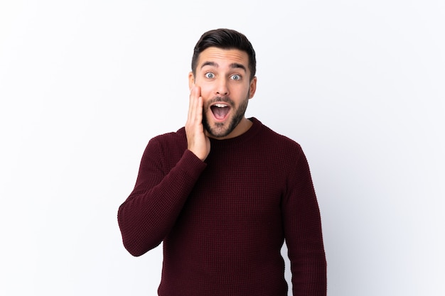 Young man over isolated white wall