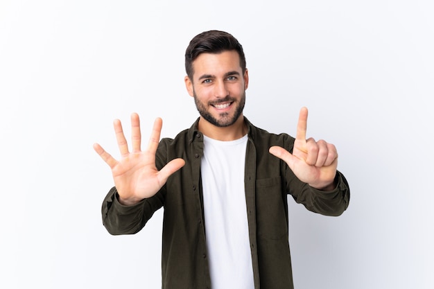 Young man over isolated white wall