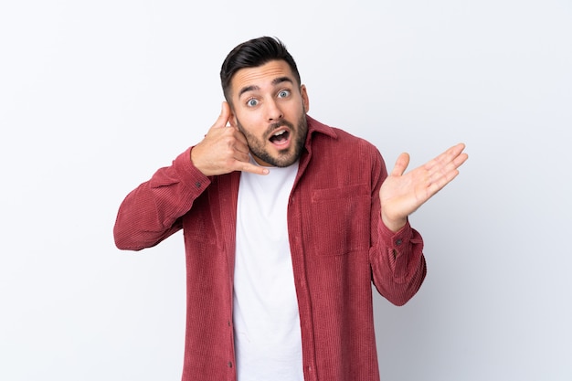 Young man over isolated white wall