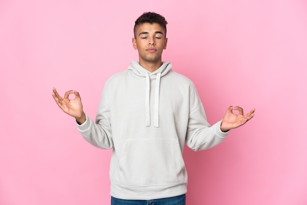 Young man isolated in zen pose