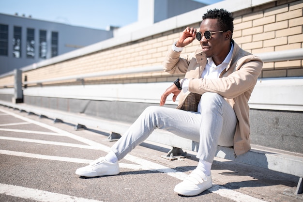 Young man in a jacket and white shirt