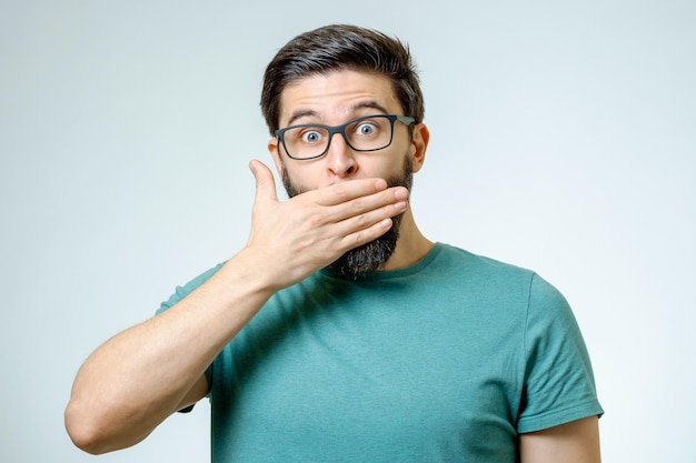 young man keep his mouth closed