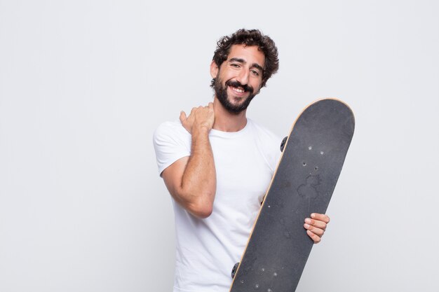 Young man laughing cheerfully and confidently with a casual, happy, friendly smile