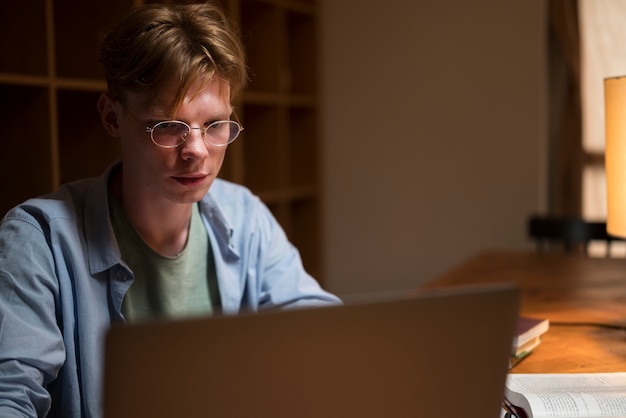 Young man learning in a virtual classroom