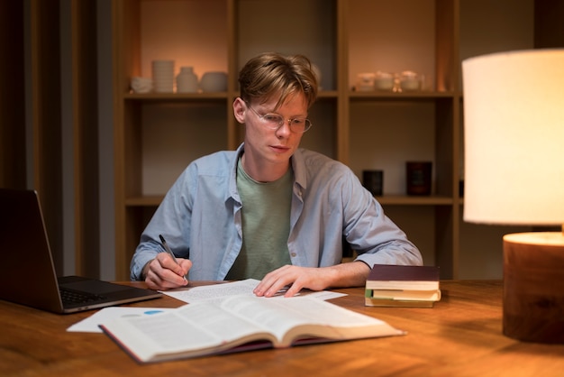 Young man learning in a virtual classroom