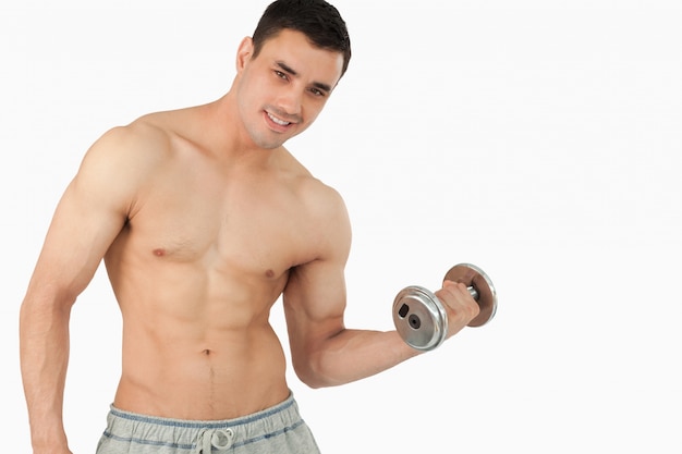 Young man lifting weight