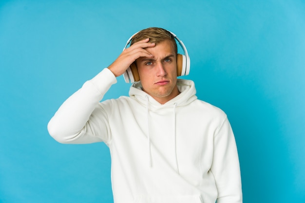 Young man listening music dreaming of achieving goals and purposes