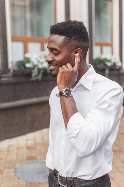 Young man listening to music in earphones