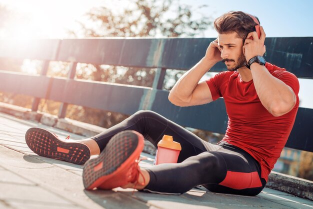 Young man listening to music on a smart phone