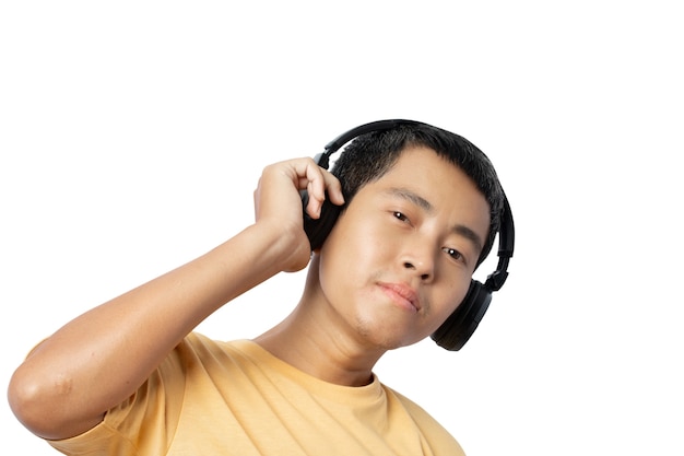 Young man listening music with headphones isolated on white background. clipping paths.