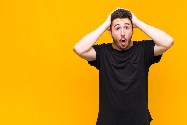 Young man looking excited and surprised