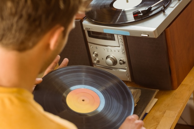 Young man looking at his vinyl collection