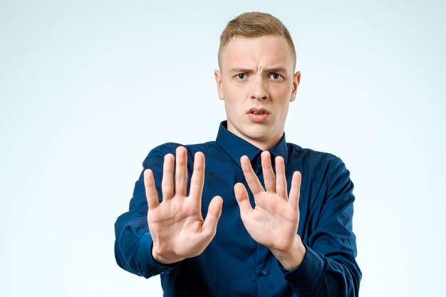 Young man looking shocked scared