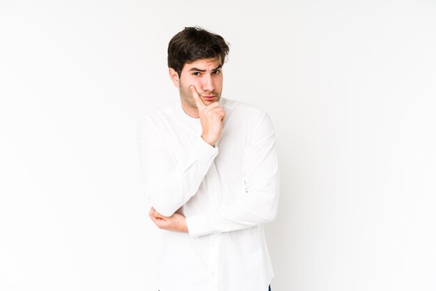 young man looking sideways with doubtful and skeptical expression.