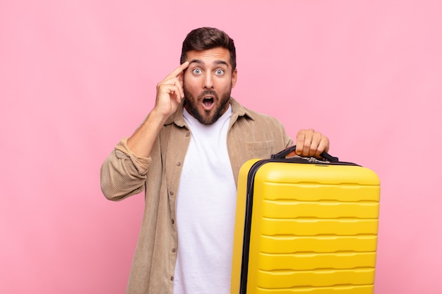 Young man looking surprised, open-mouthed, shocked