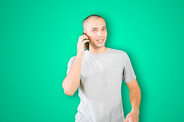 Young man make a call phone on studio