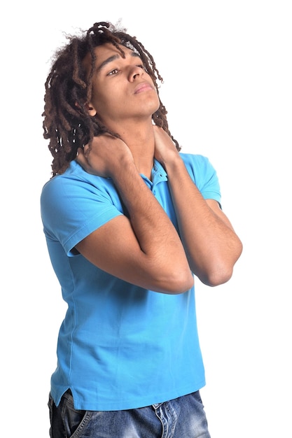 Young man making facial expression against white background