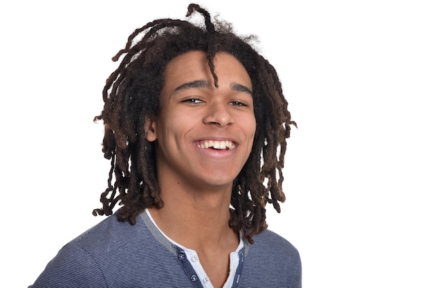 Young man making facial expression against white background