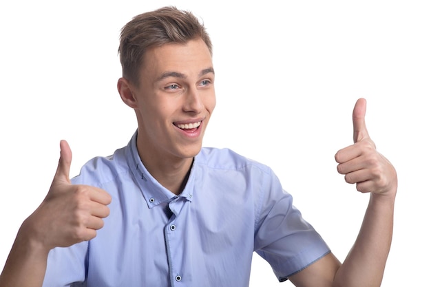 Young man making facial expression against white background