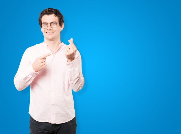 Young man making a gesture of worried about his economy