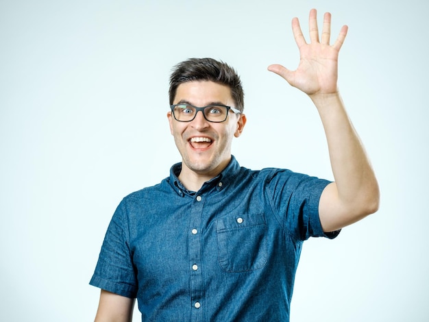 Young man making high five gesture