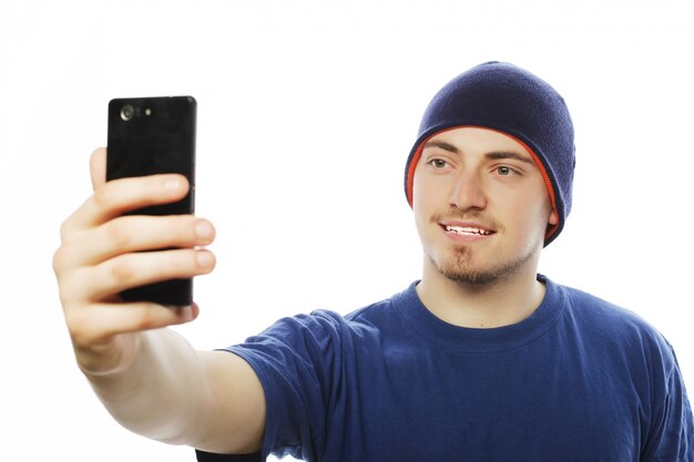 Young man making photo of himself