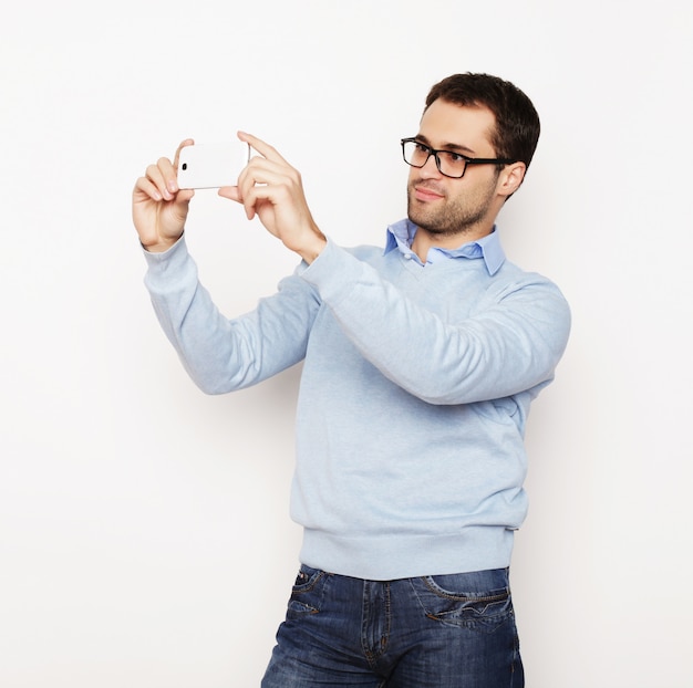 young man making photo of himself