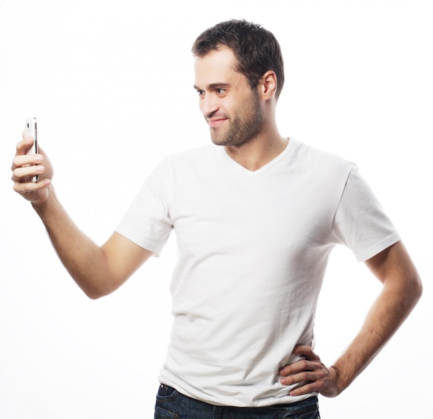 Young man making photo of himself